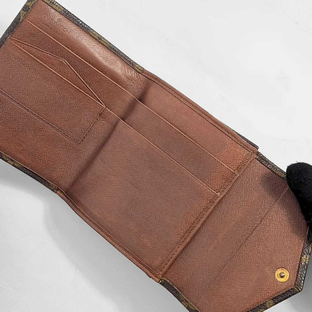 Brown leather wallet with visible stitching on a white background