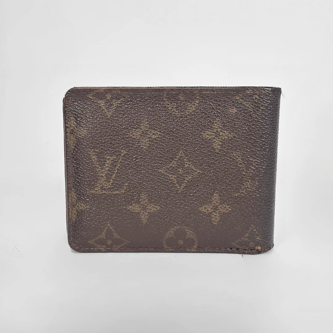 Brown leather wallet on a light gray background