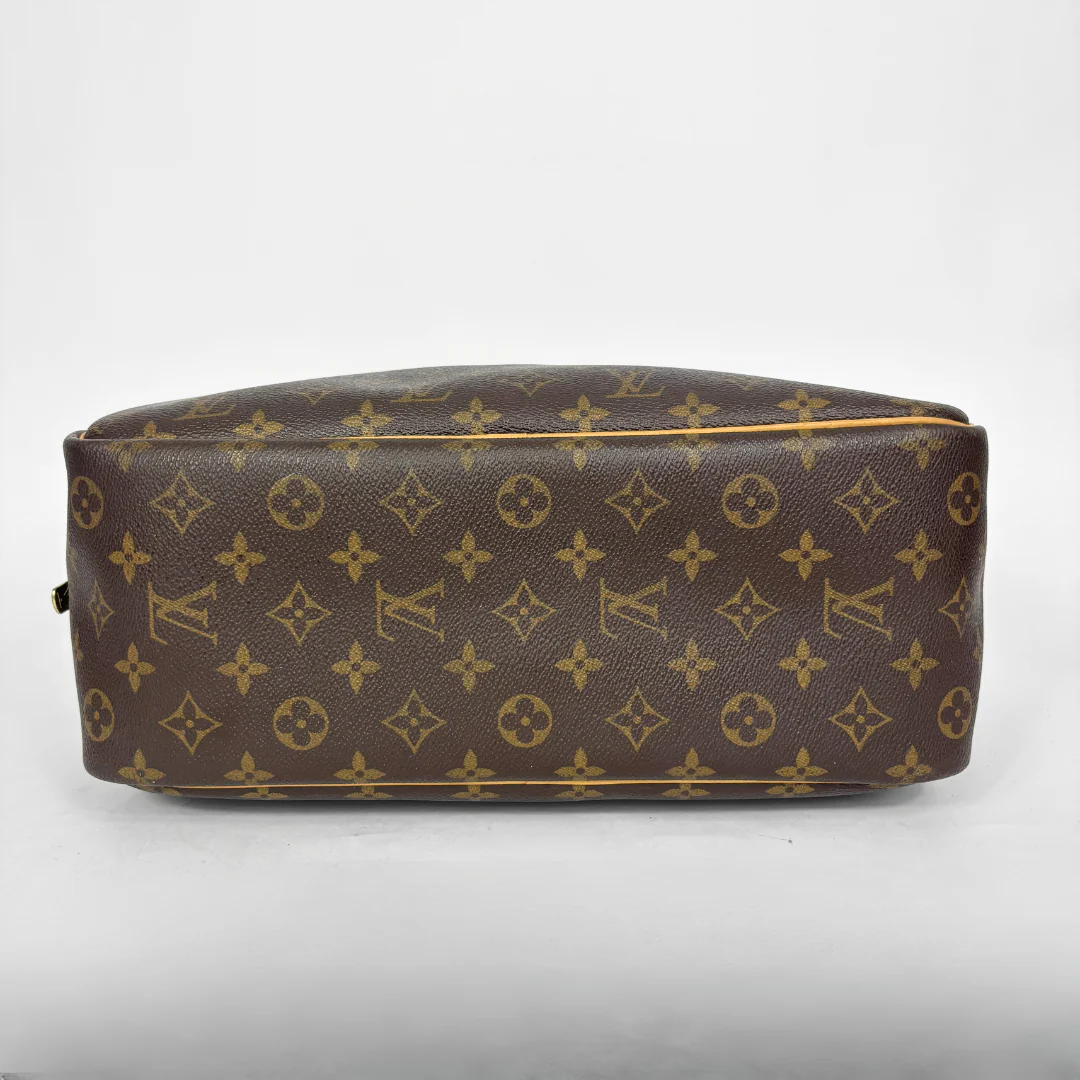 Designer handbag with monogram pattern on a white background
