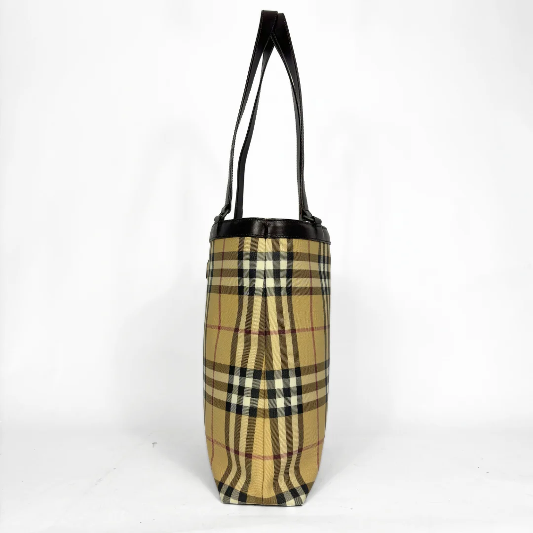 Beige checkered tote bag with black handle on a white background