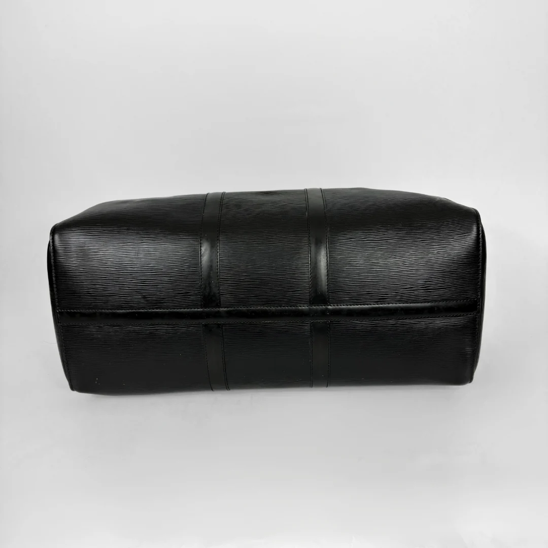 Black leather clutch bag on a white background