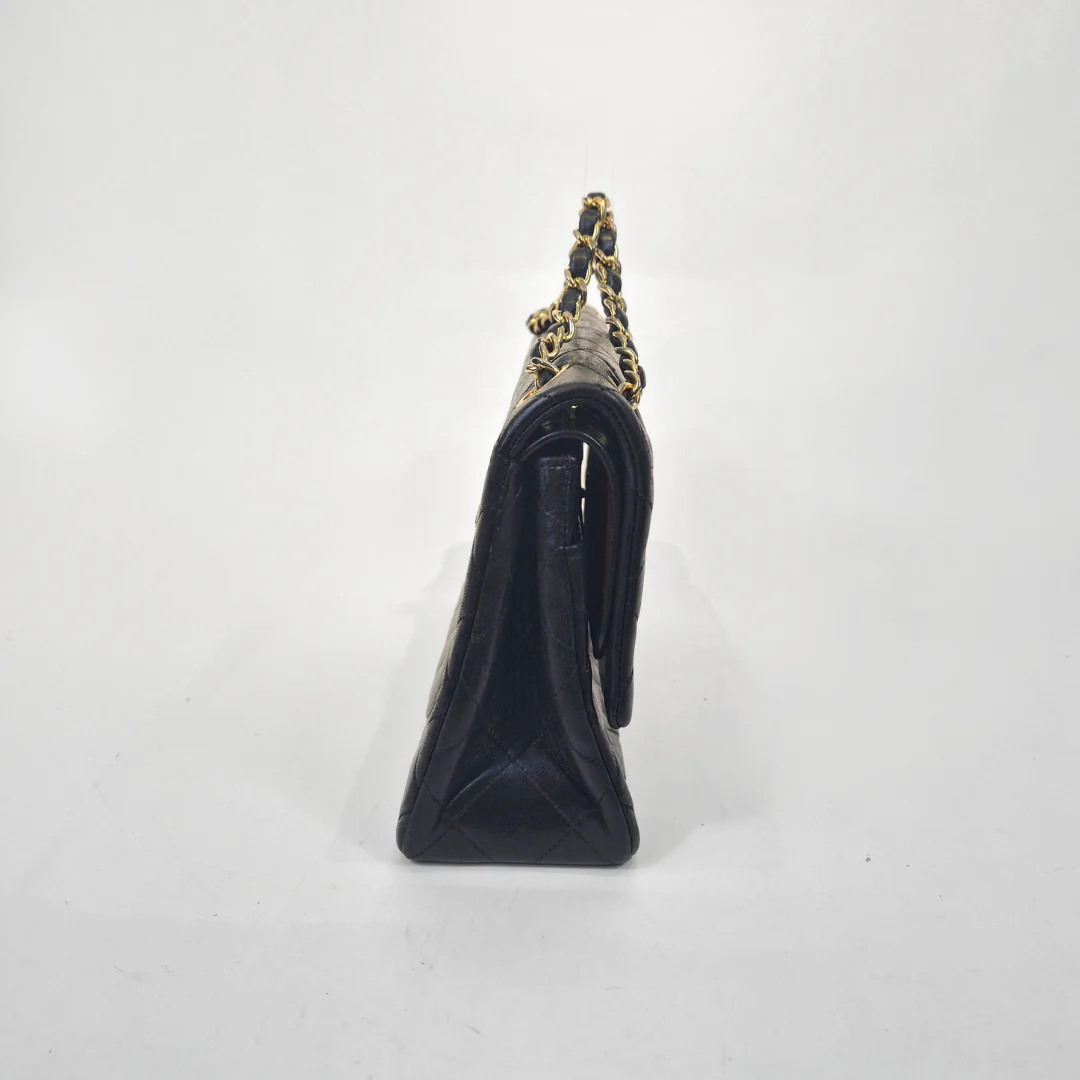 Black and silver vacuum cleaner on a white background