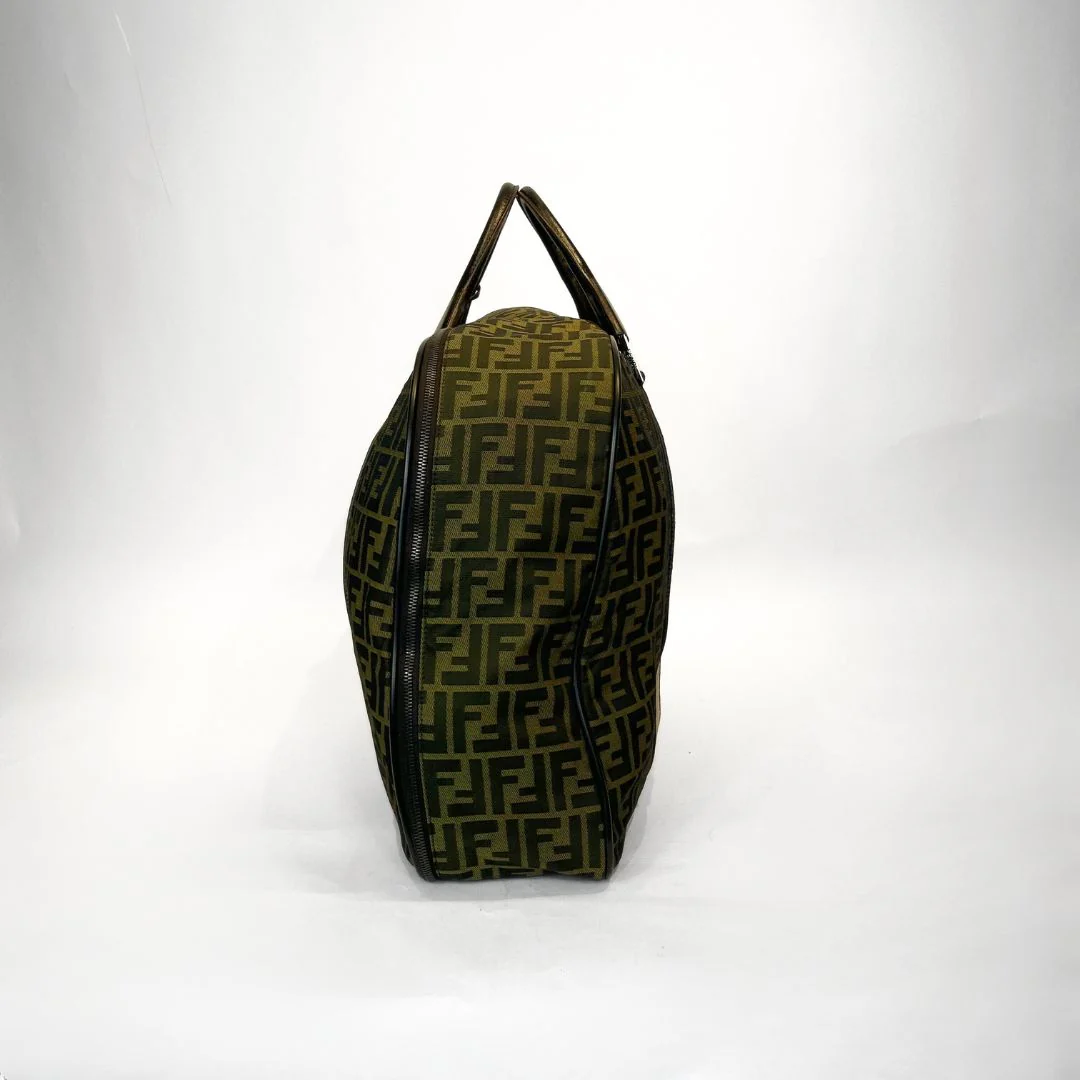 Designer handbag with a distinctive pattern on a white background