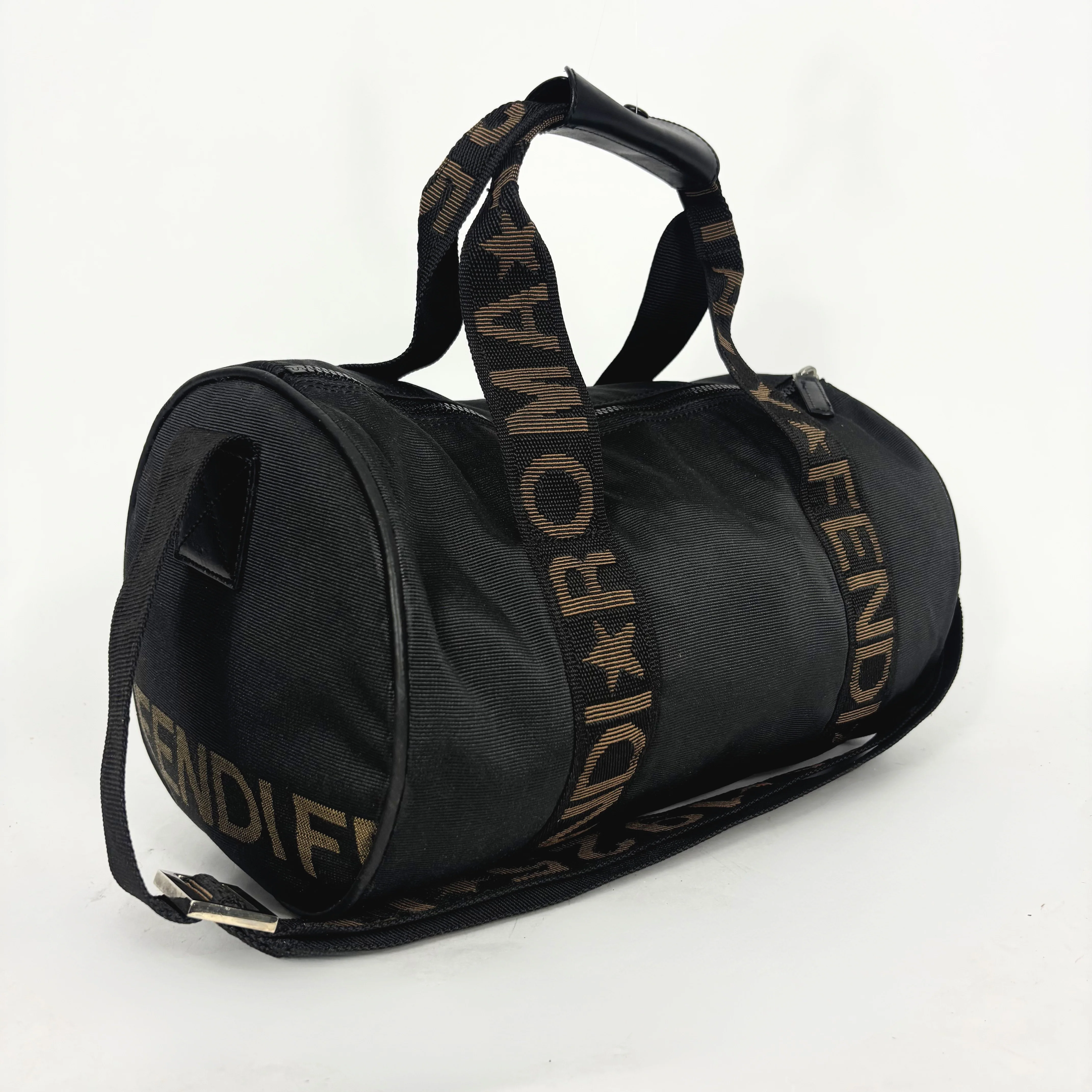 Black duffel bag with gold Fendi branding on a white background