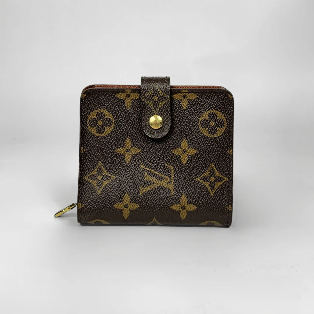 Brown wallet with gold monogram pattern on a white background