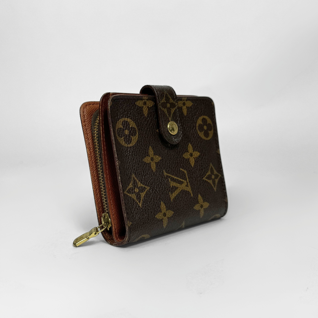 Brown wallet with gold monogram pattern on a white background