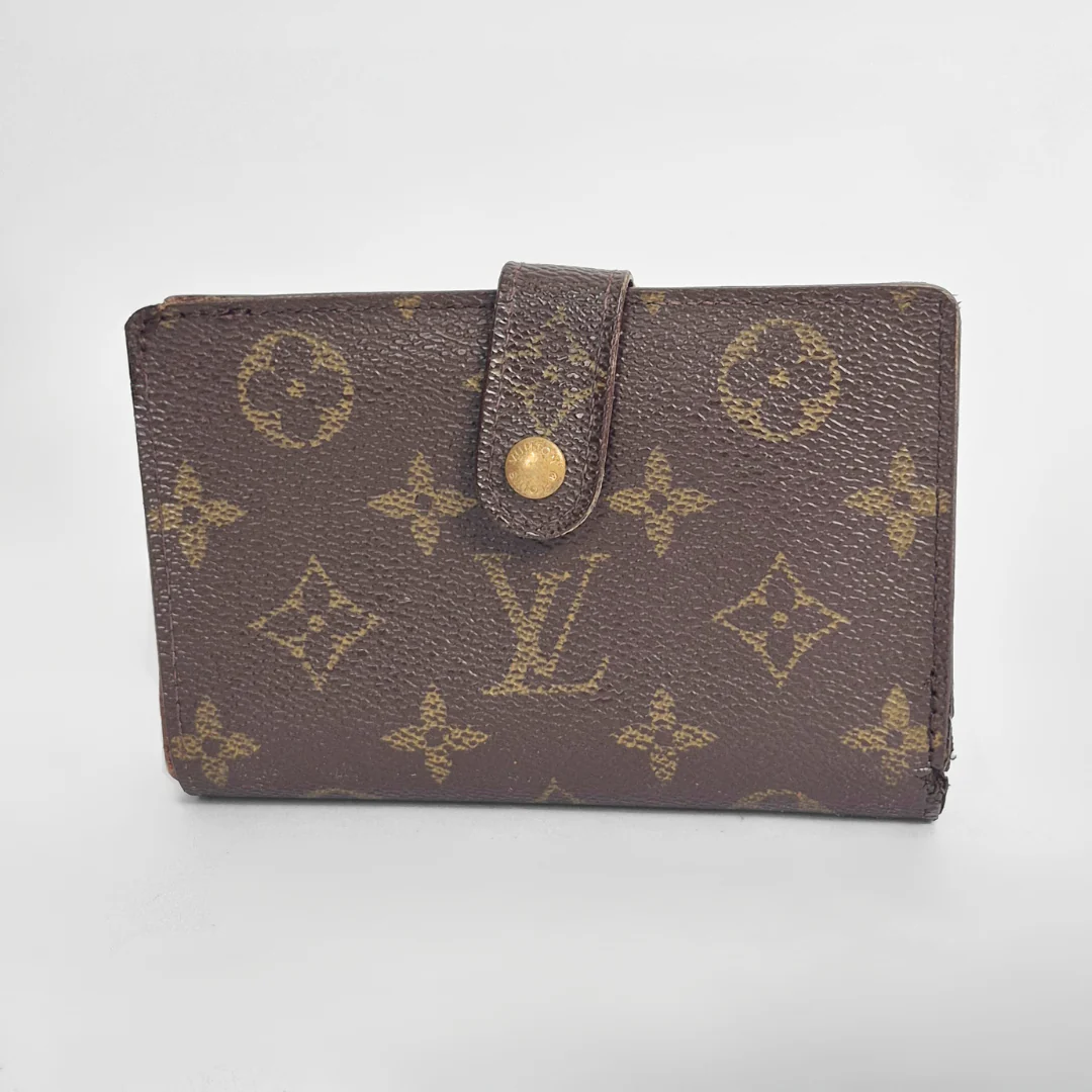 Brown leather wallet with gold accents on a light gray background