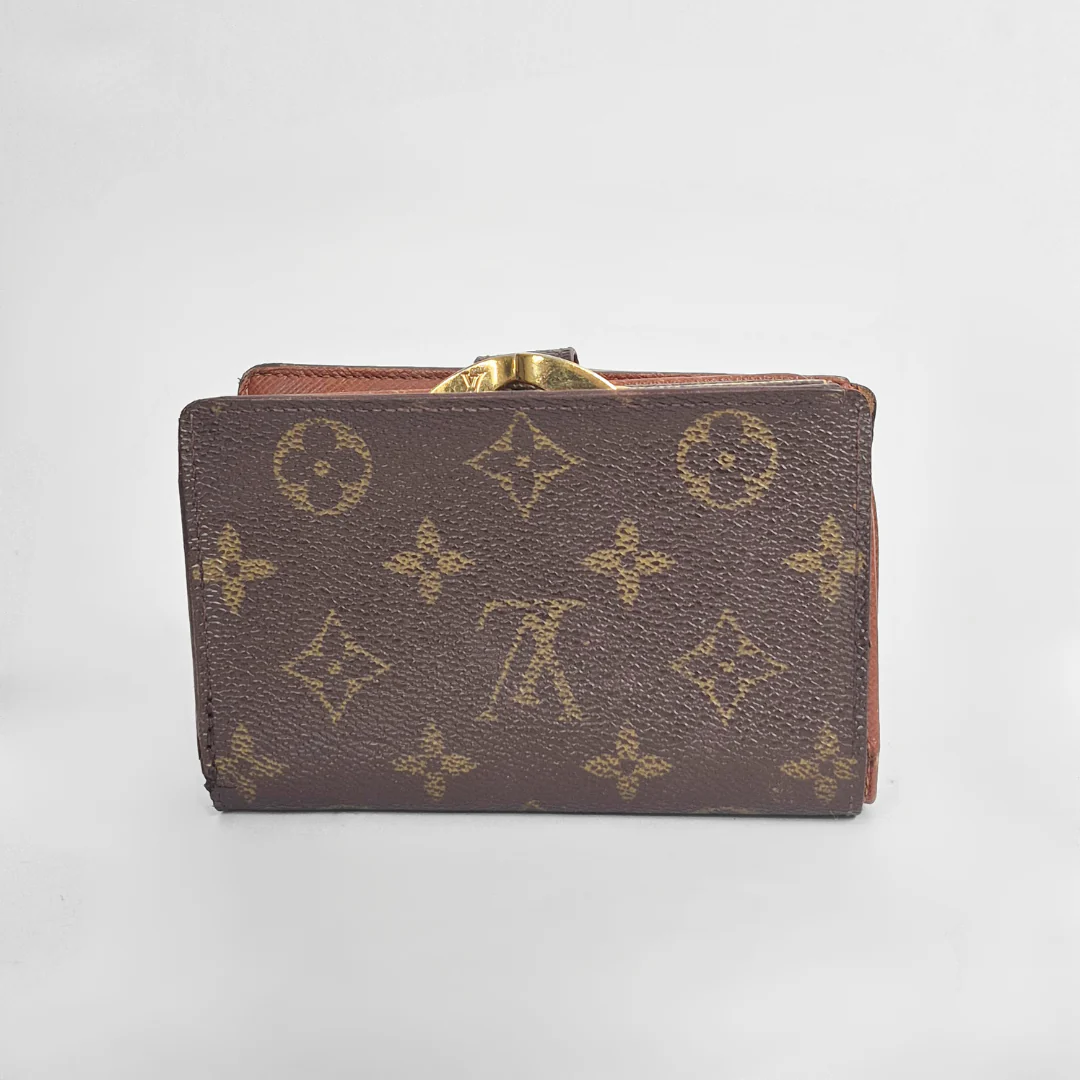 Brown leather wallet with gold accents on a light gray background