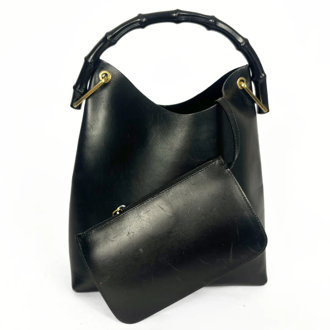 Gucci vintage black leather hobo hag with a dark wood bamboo top handle and gold-tone hardware.