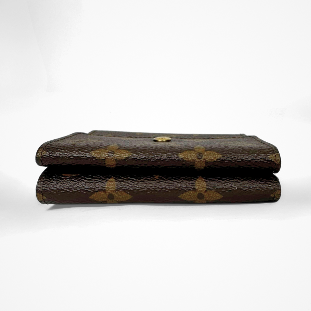 Louis Vuitton Druk Wallet on a white background
