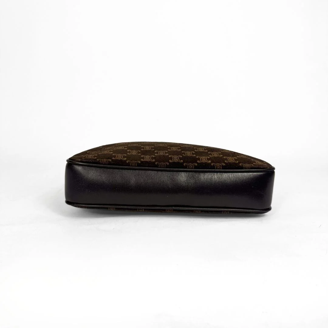 Black and brown patterned cushion on a white background