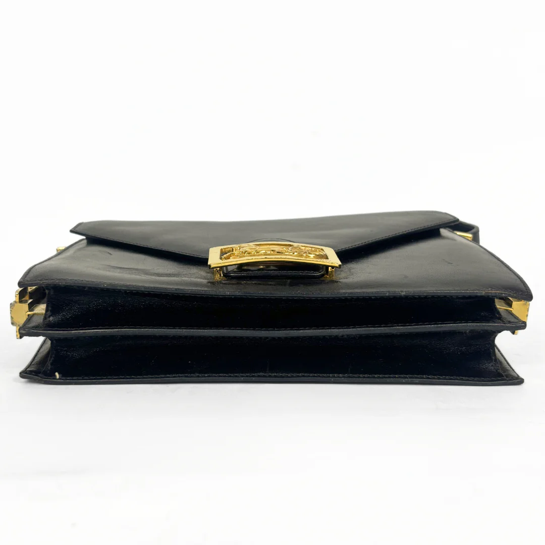 Celine vintage black leather shoulder bag with gold-tone horse and cariage buckle.