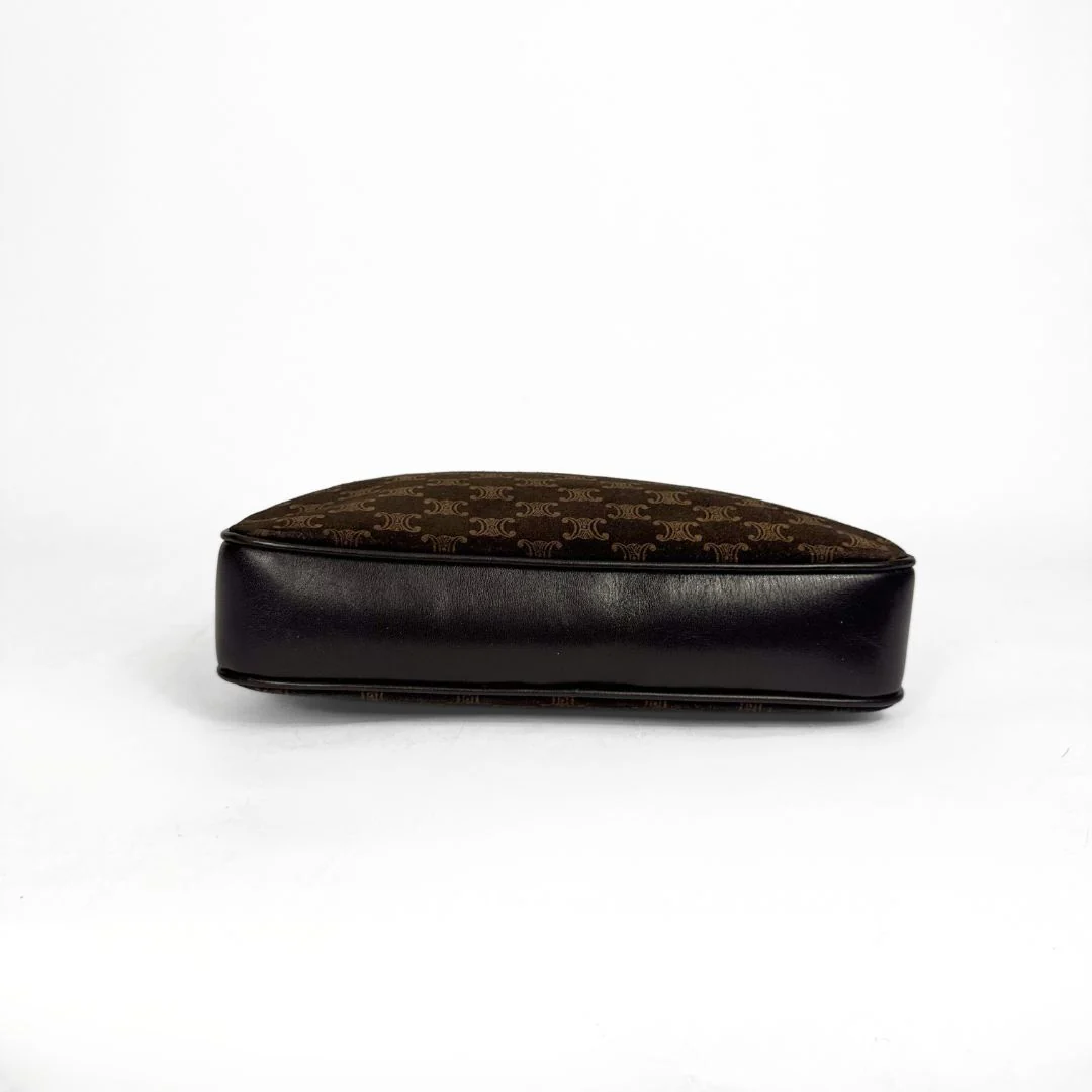 Black and brown patterned cushion on a white background