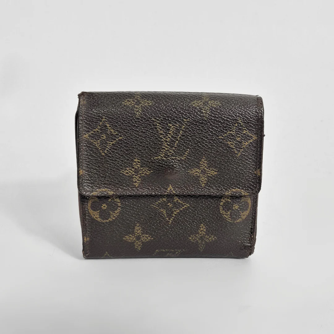 Brown wallet with monogram pattern on a light gray background