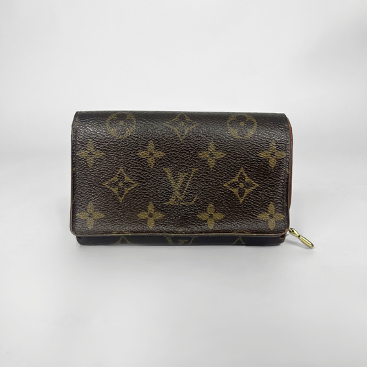 Louis Vuitton wallet with monogram pattern on a white background