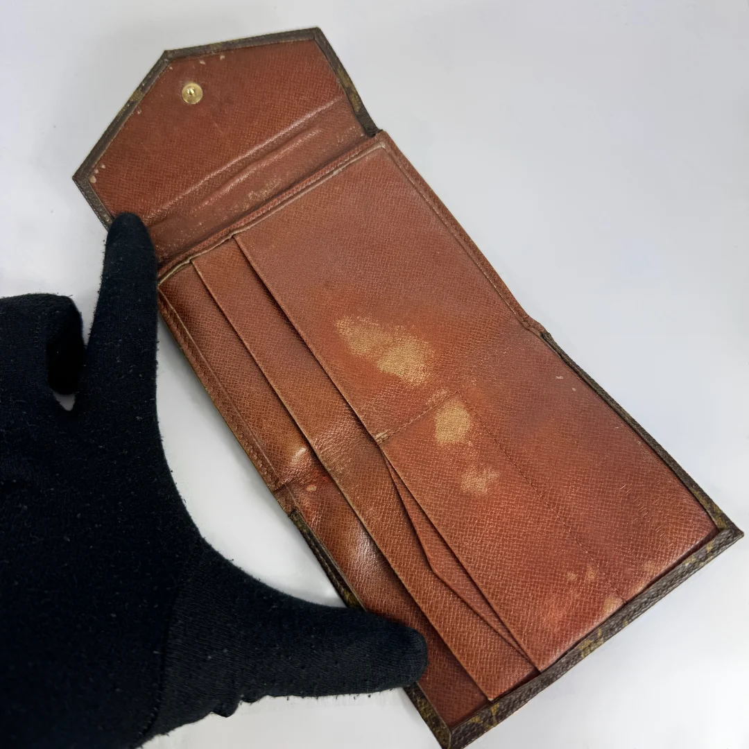 Louis Vuitton Druk Wallet on a white background