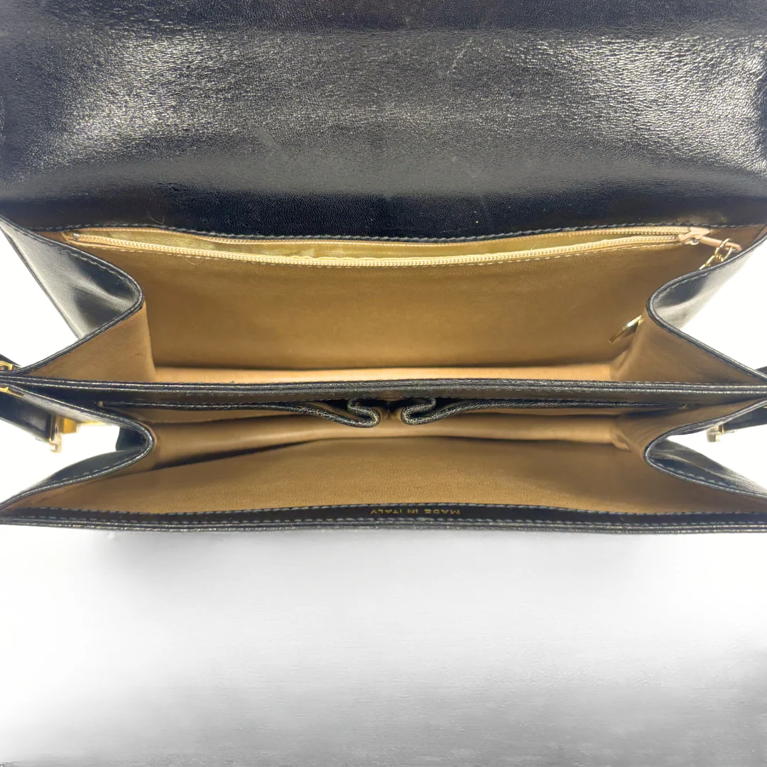 Celine vintage black leather shoulder bag with gold-tone horse and cariage buckle.