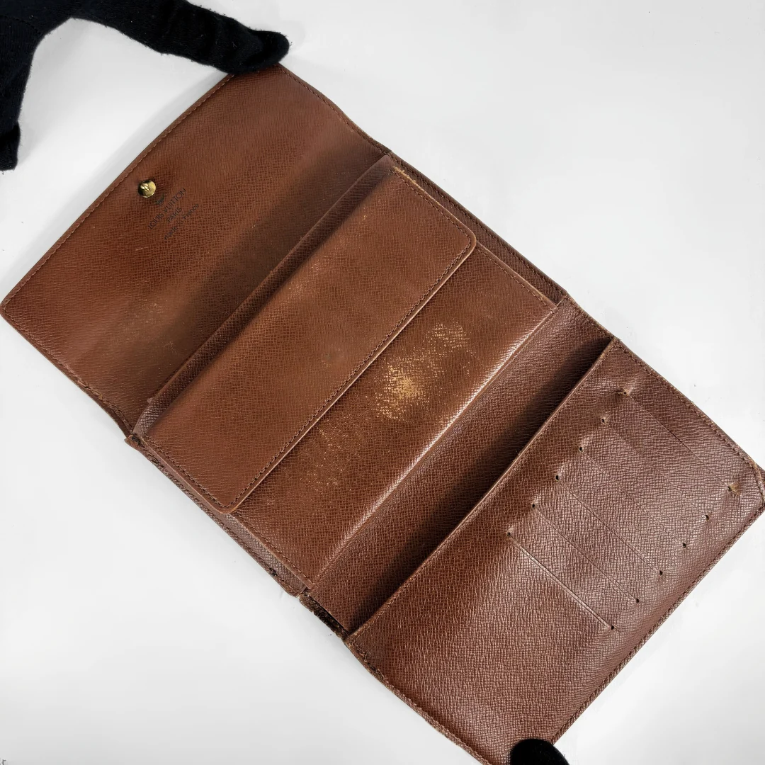 Louis Vuitton International Wallet Medium on a white background