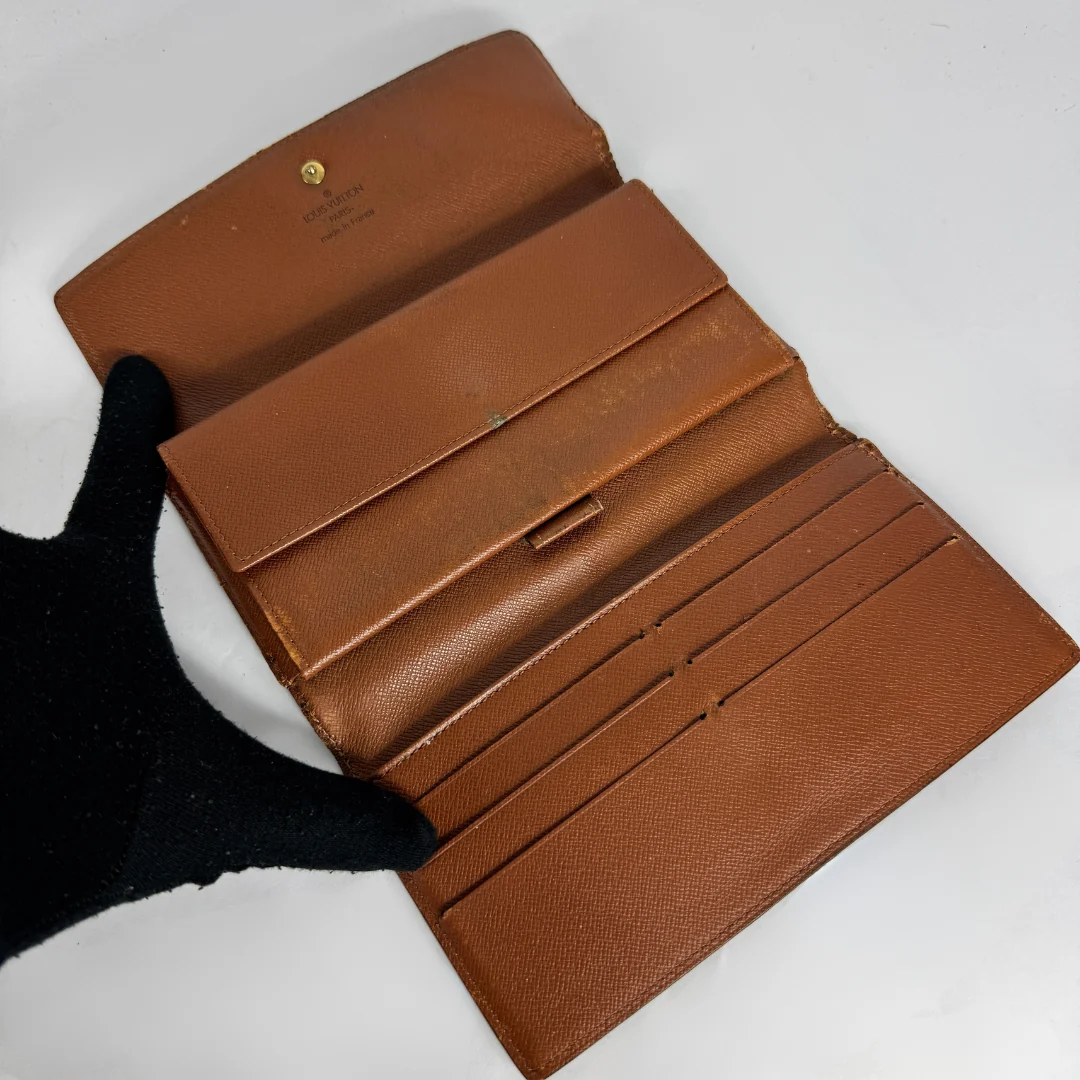 Louis Vuitton Wallet International on a white background