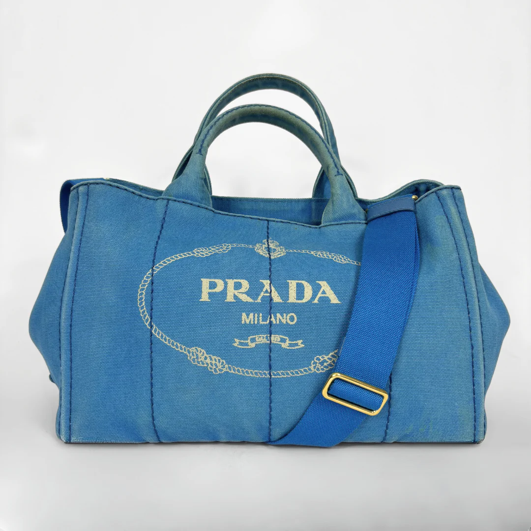 Blue Prada handbag on a white background