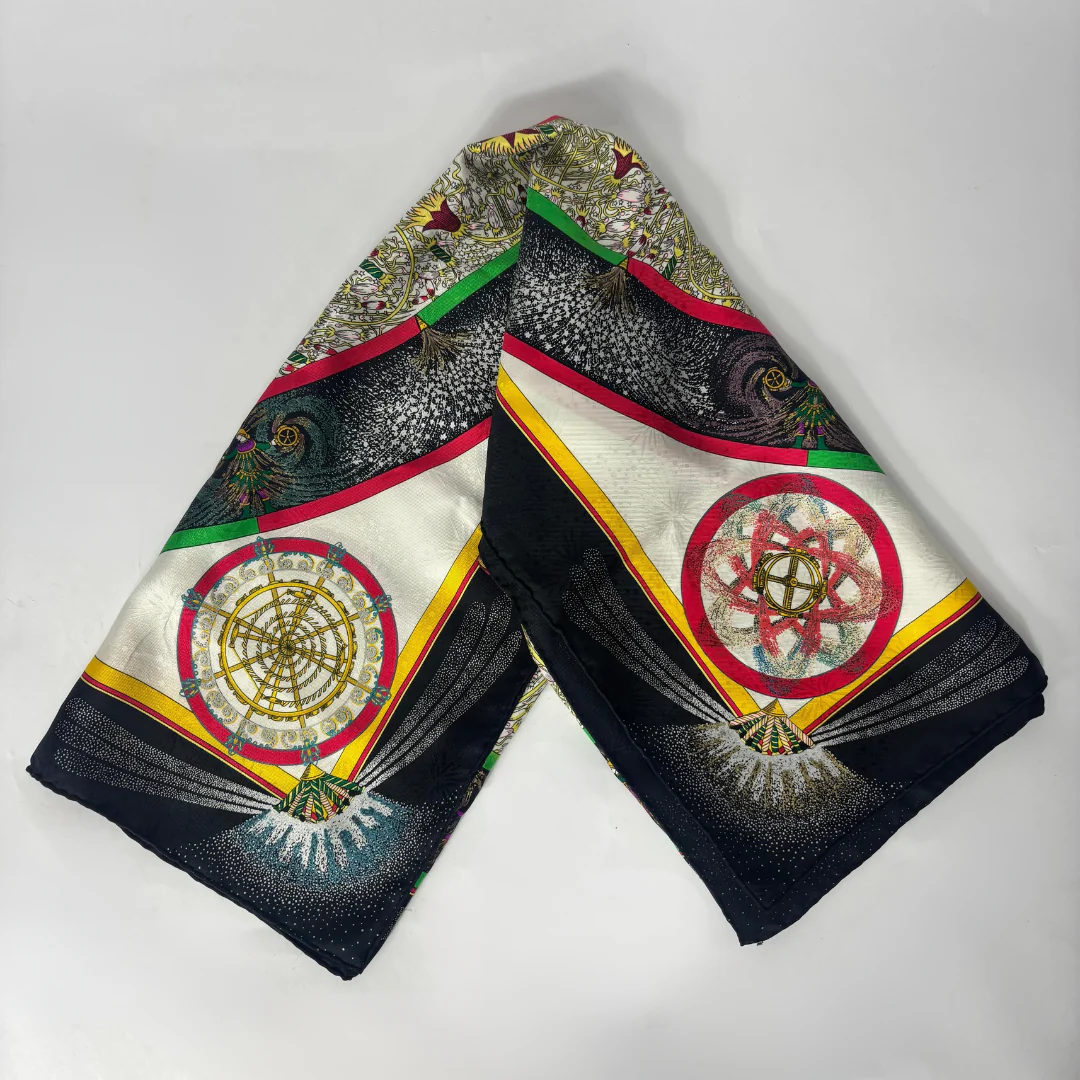 Decorative headscarf with intricate patterns on a white background