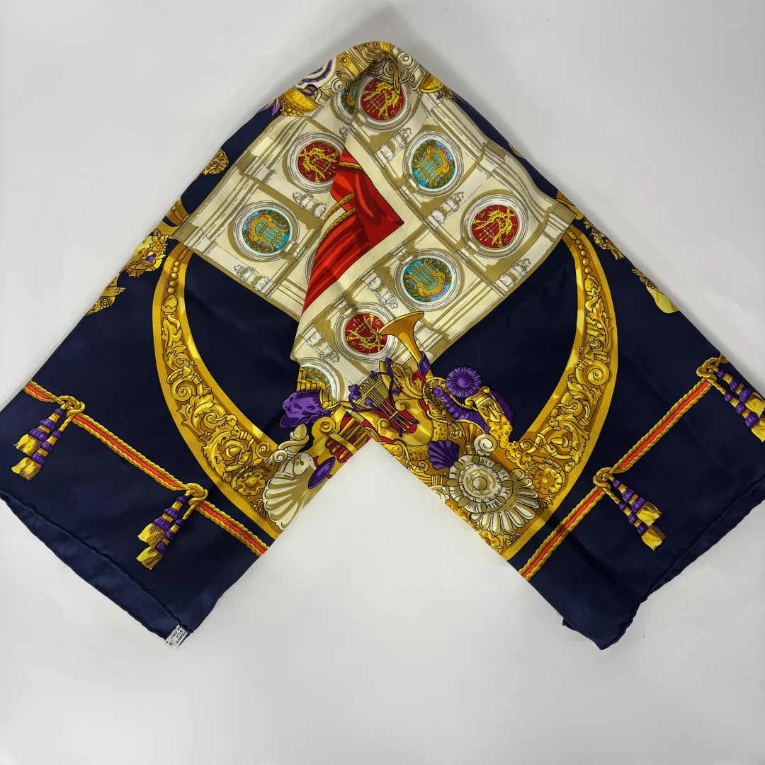 Decorative scarf with intricate patterns on a white background